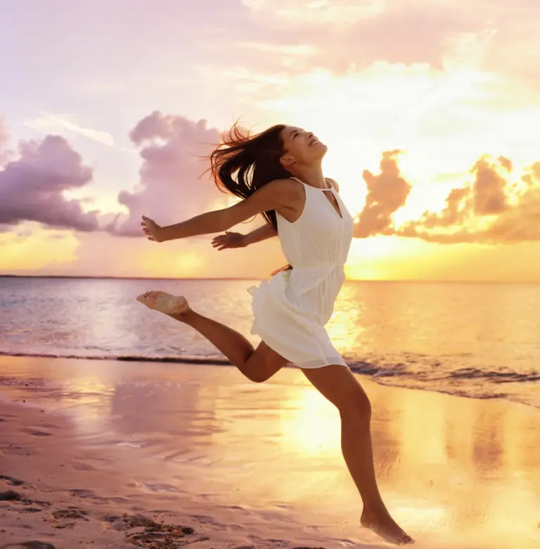 Woman running with energy on the beach